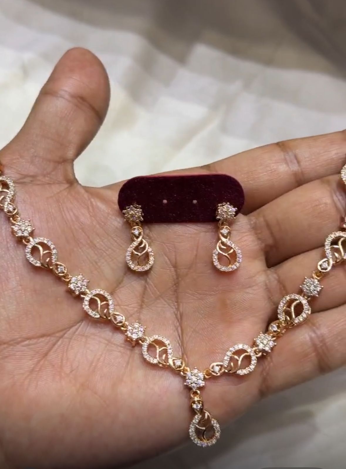 Jewellity Crystal-Studded Gold-Plated Necklace and Earrings Set, Modern Floral Paisley Design, Sleek Look, Rose Gold Finish, NSG-109